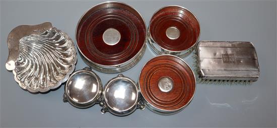 A late Victorian silver butter shell, three modern silver coasters, two silver salts and a clothes brush.